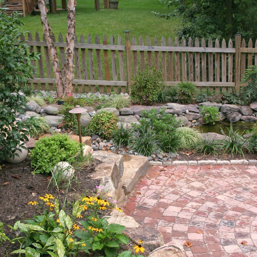 Landscaped garden with stone paving and rockery